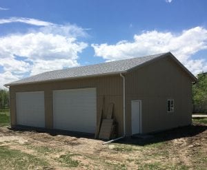 4 Car Detached Garage 48x28 T-111 siding, 12 overhangs, 4:12 reverse gable roof, 2- 16x10 doors, 11' tall walls